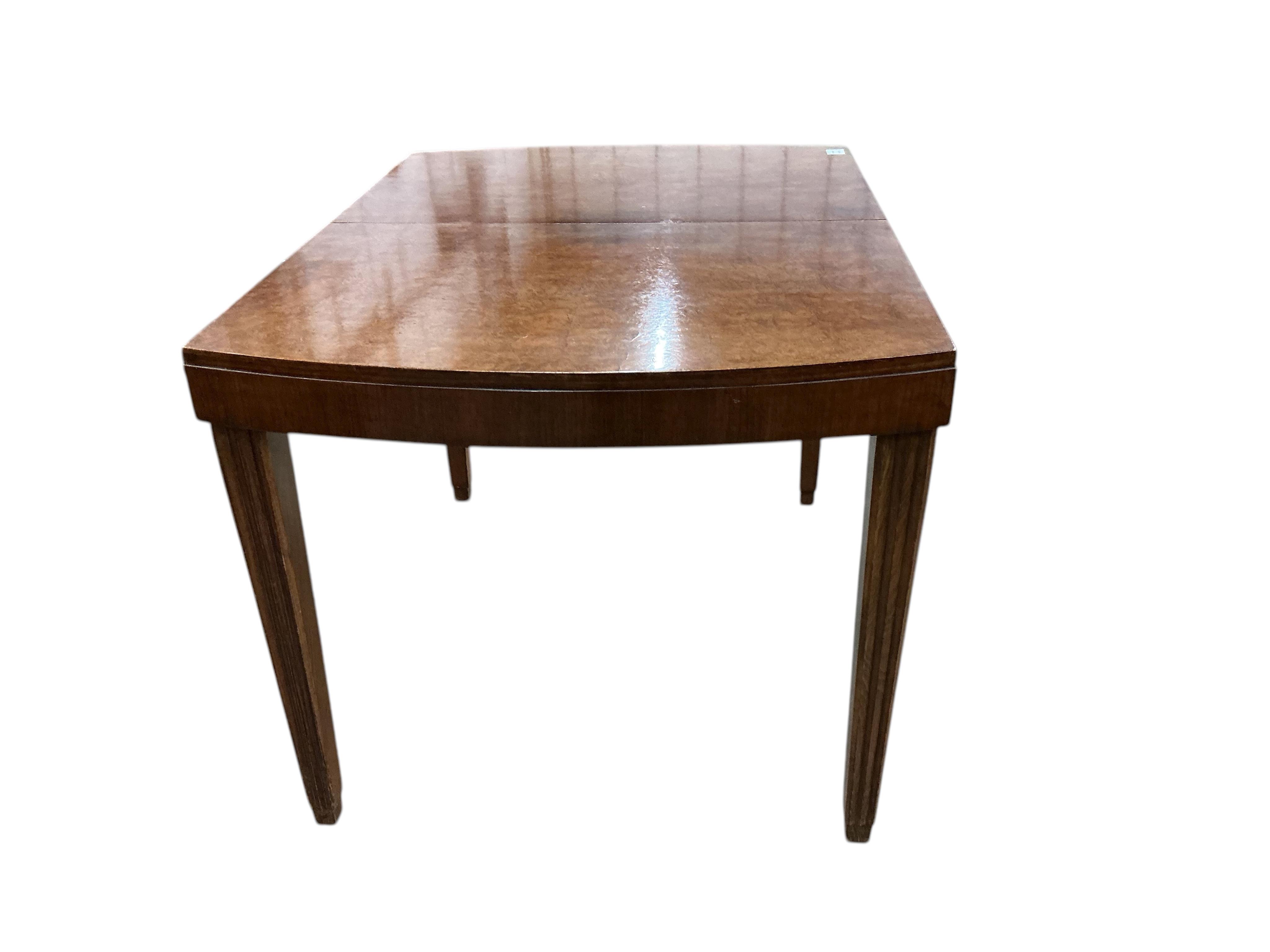 An Art Deco style beech and birds eye maple extending dining table, width 110cm, depth 84cm, height 75cm, and six similar chairs, two with arms